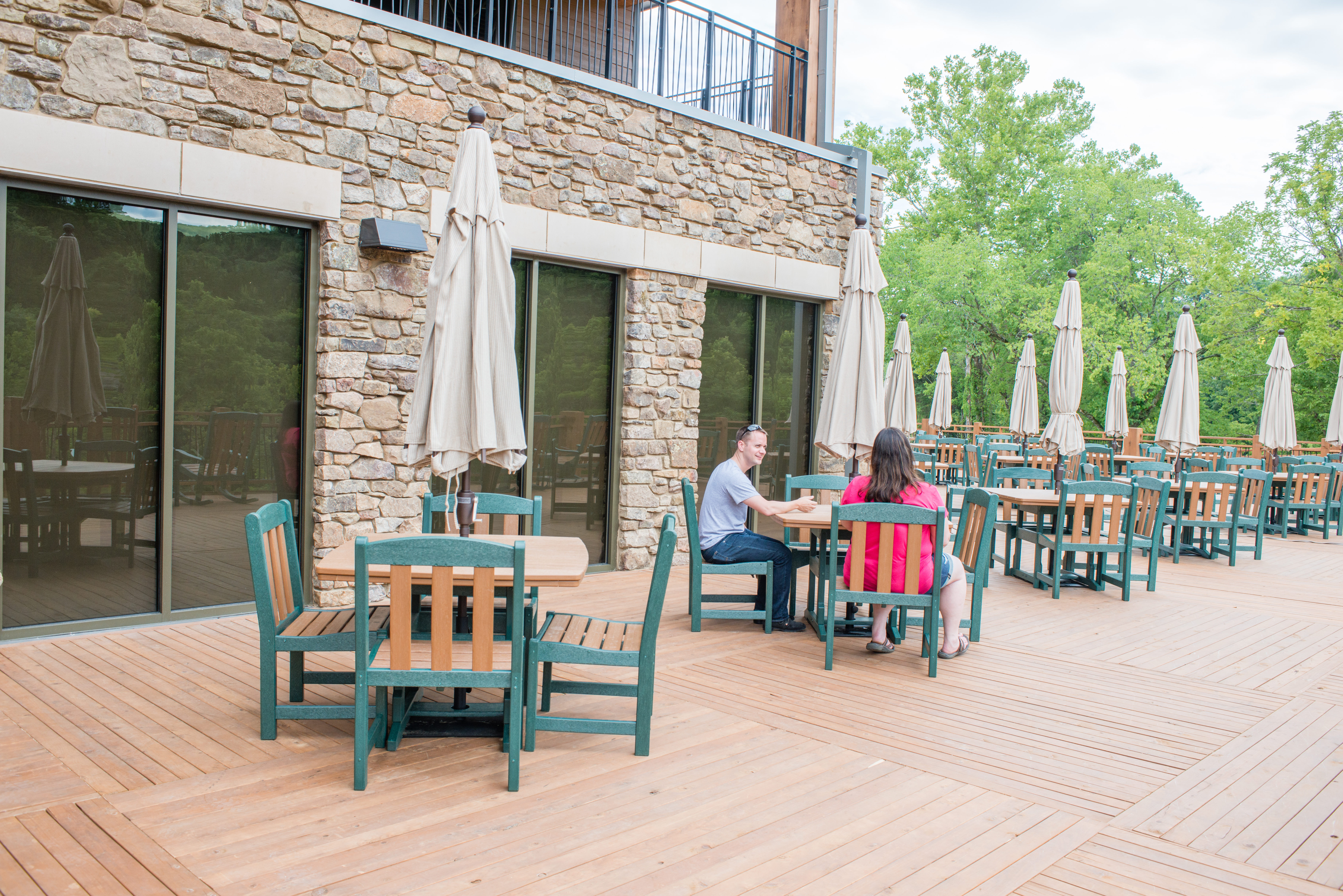 Several patio tables on a deck