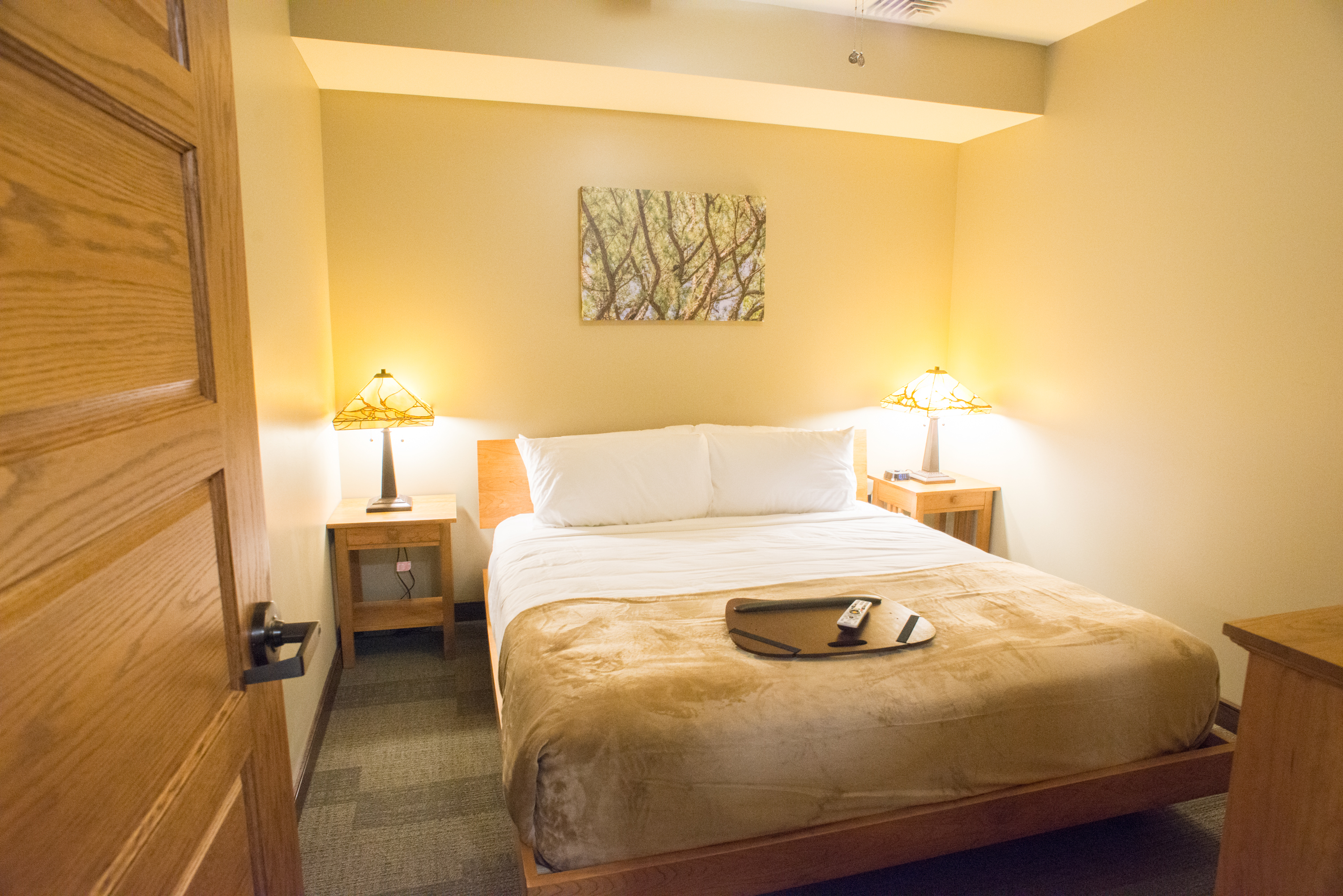 Bedroom with a full-sized bed and 2 nightstands