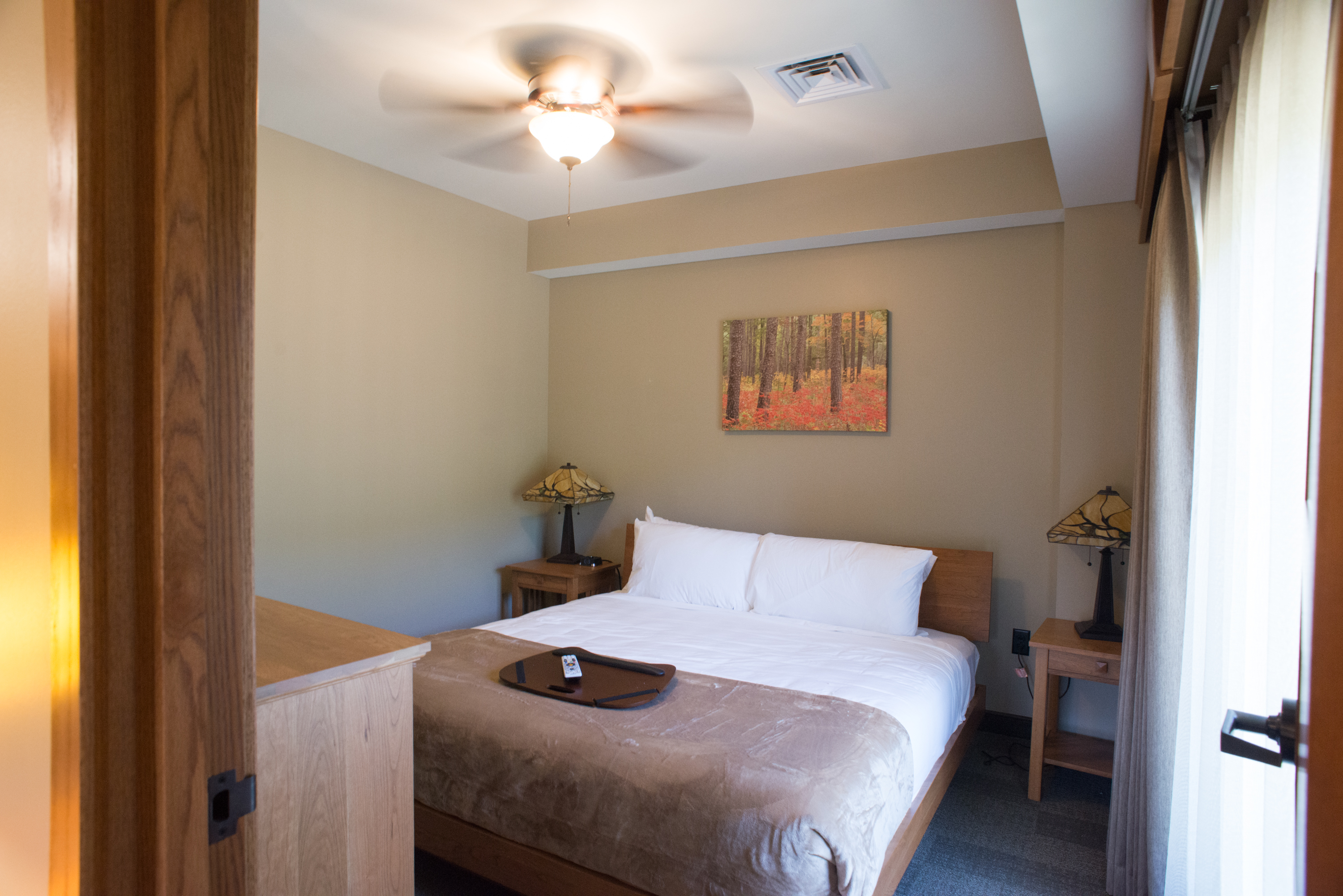 Bedroom with a full-sized bed and a dresser