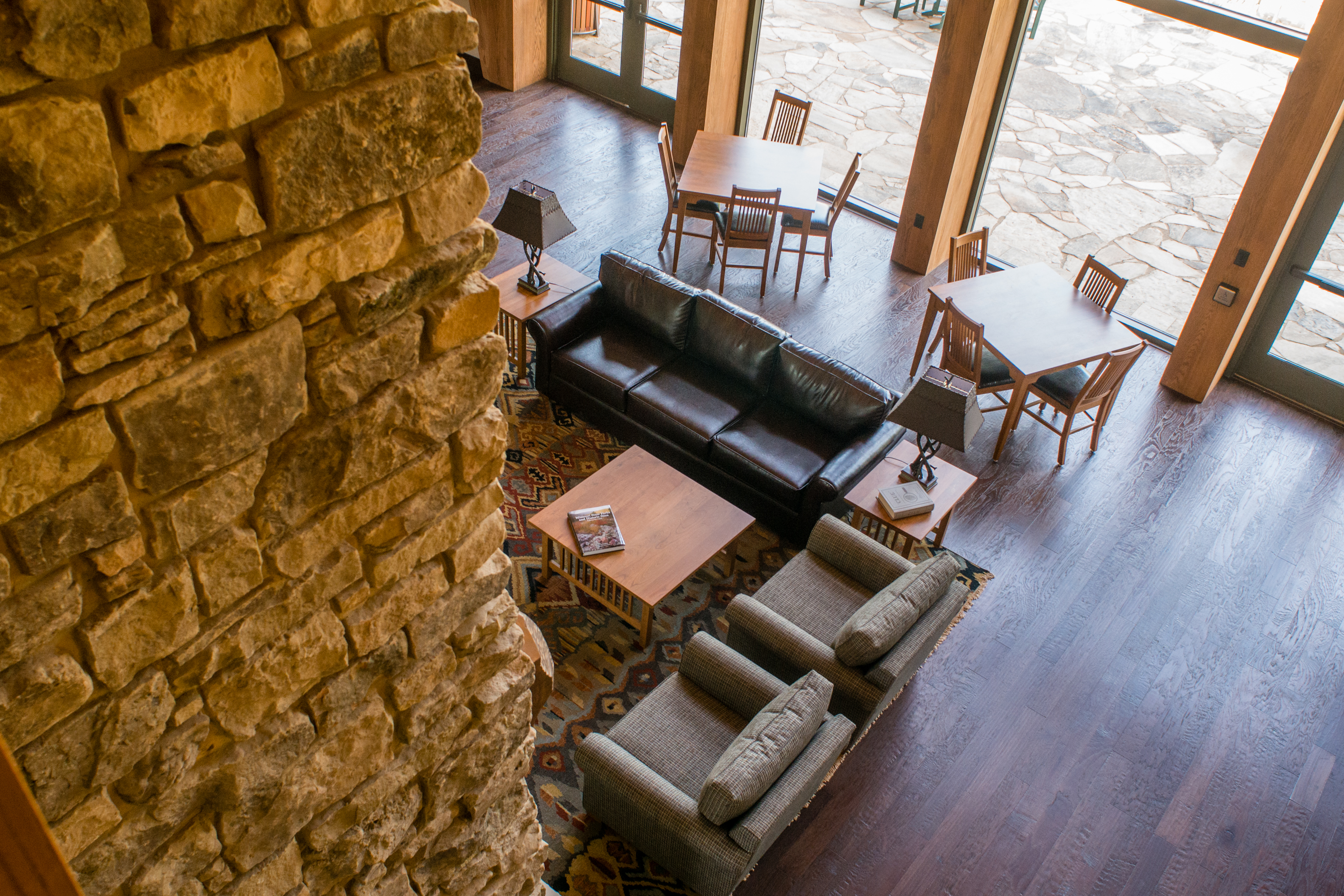 a lounge area with a couch and two chairs
