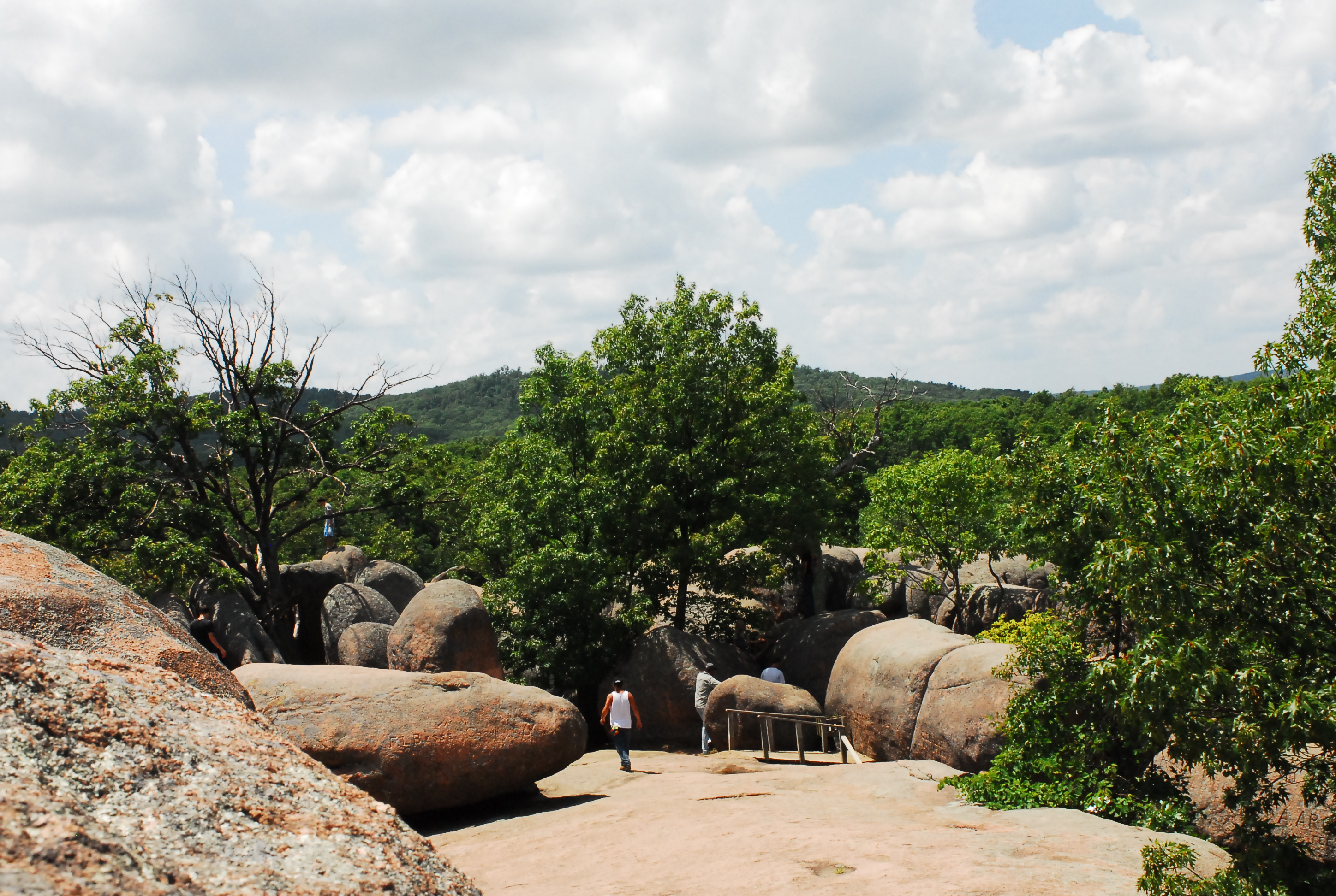 A trail going in between several boulders
