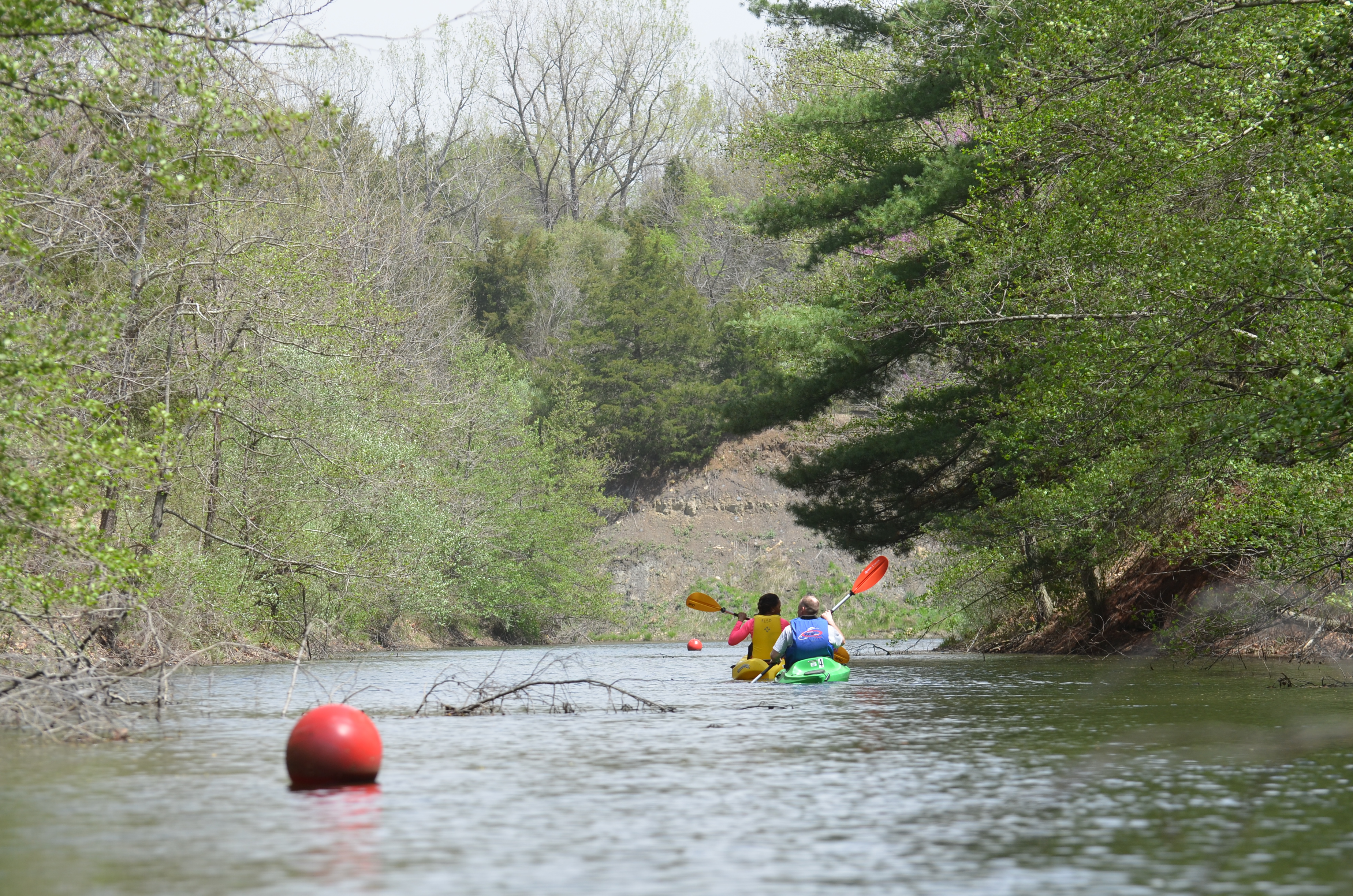 2 people kayaking on a lake