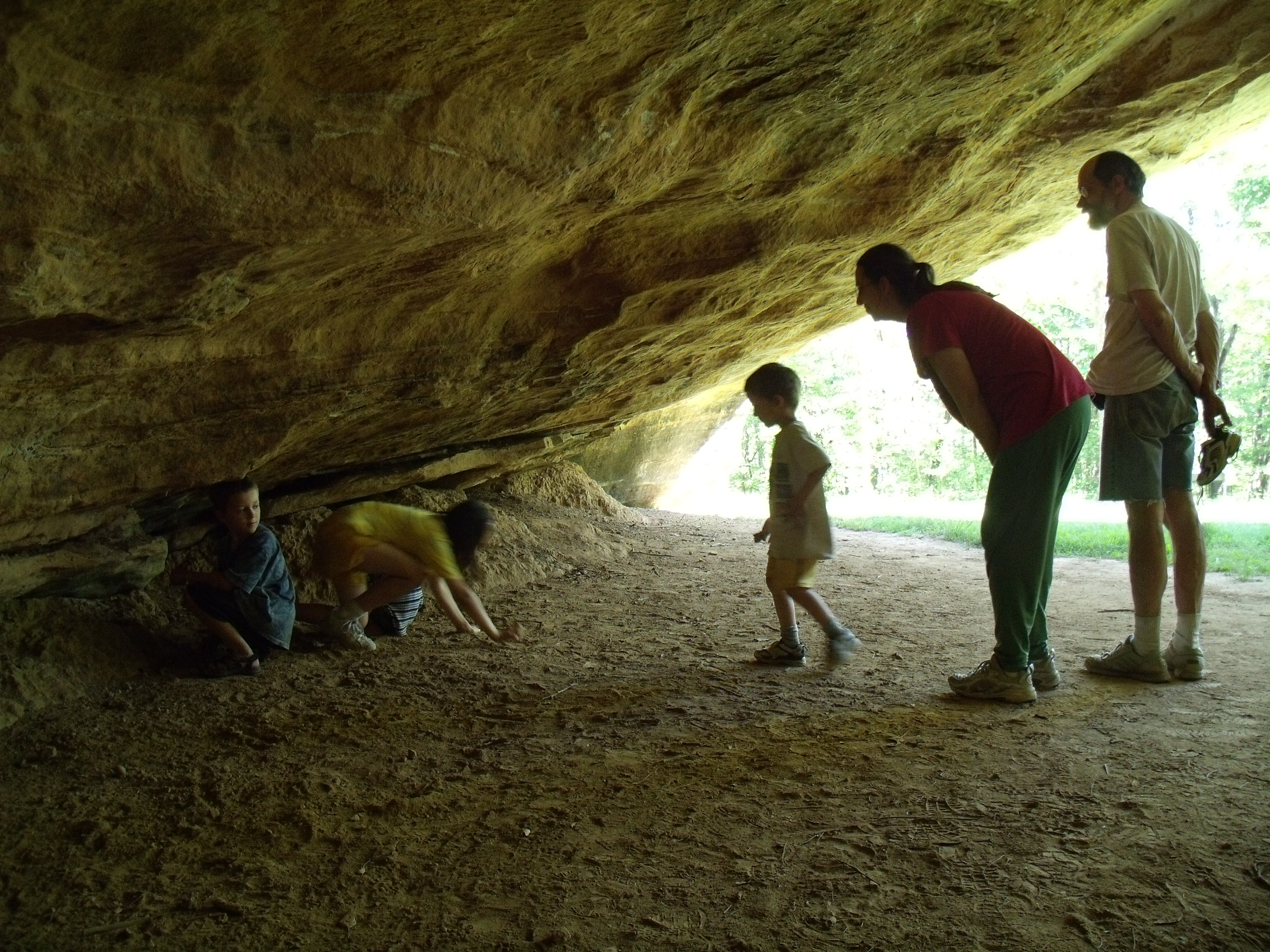 A group of people in a cave entrance