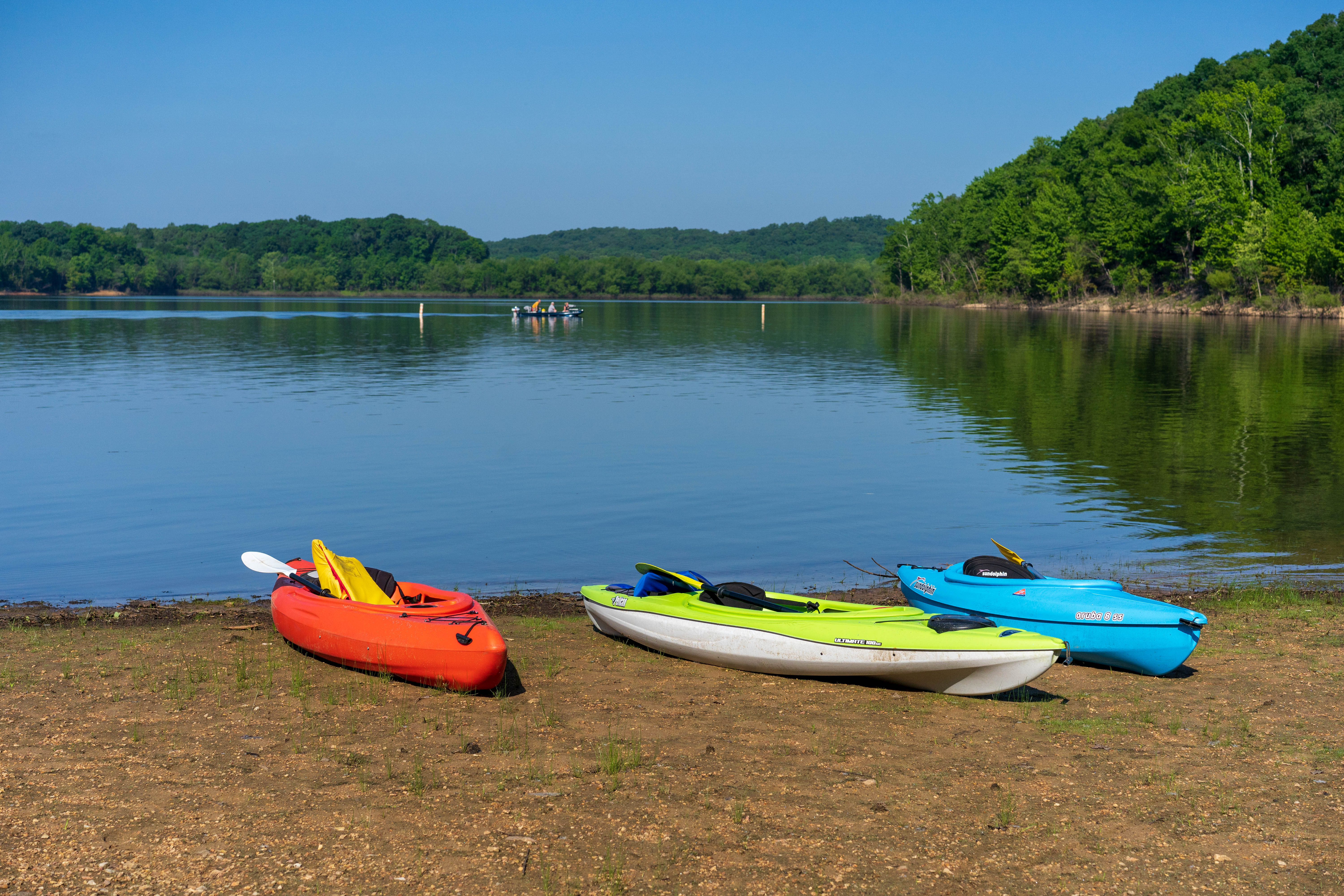 Kayaks by the water