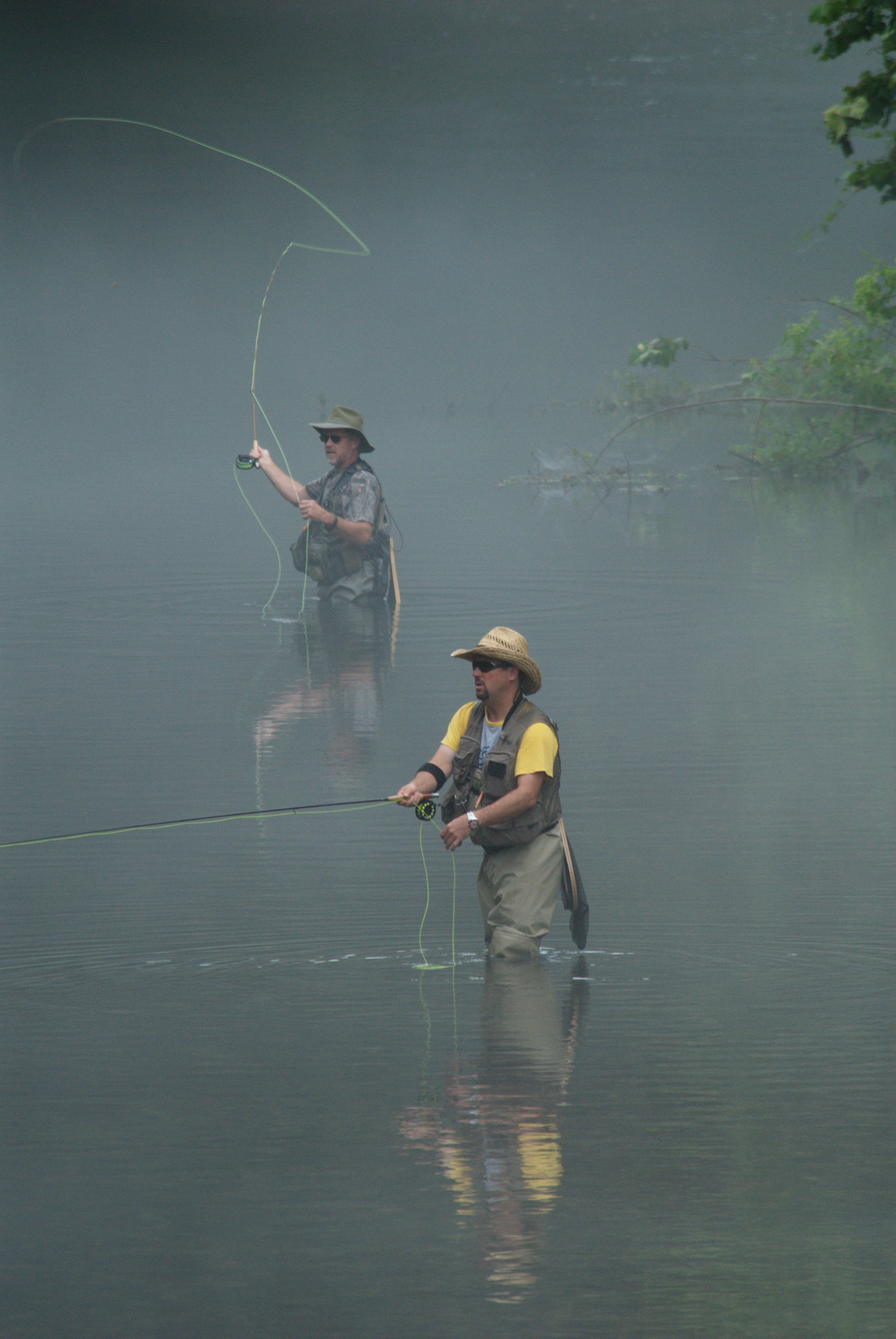 people fishing in the water at Roaring River State Park