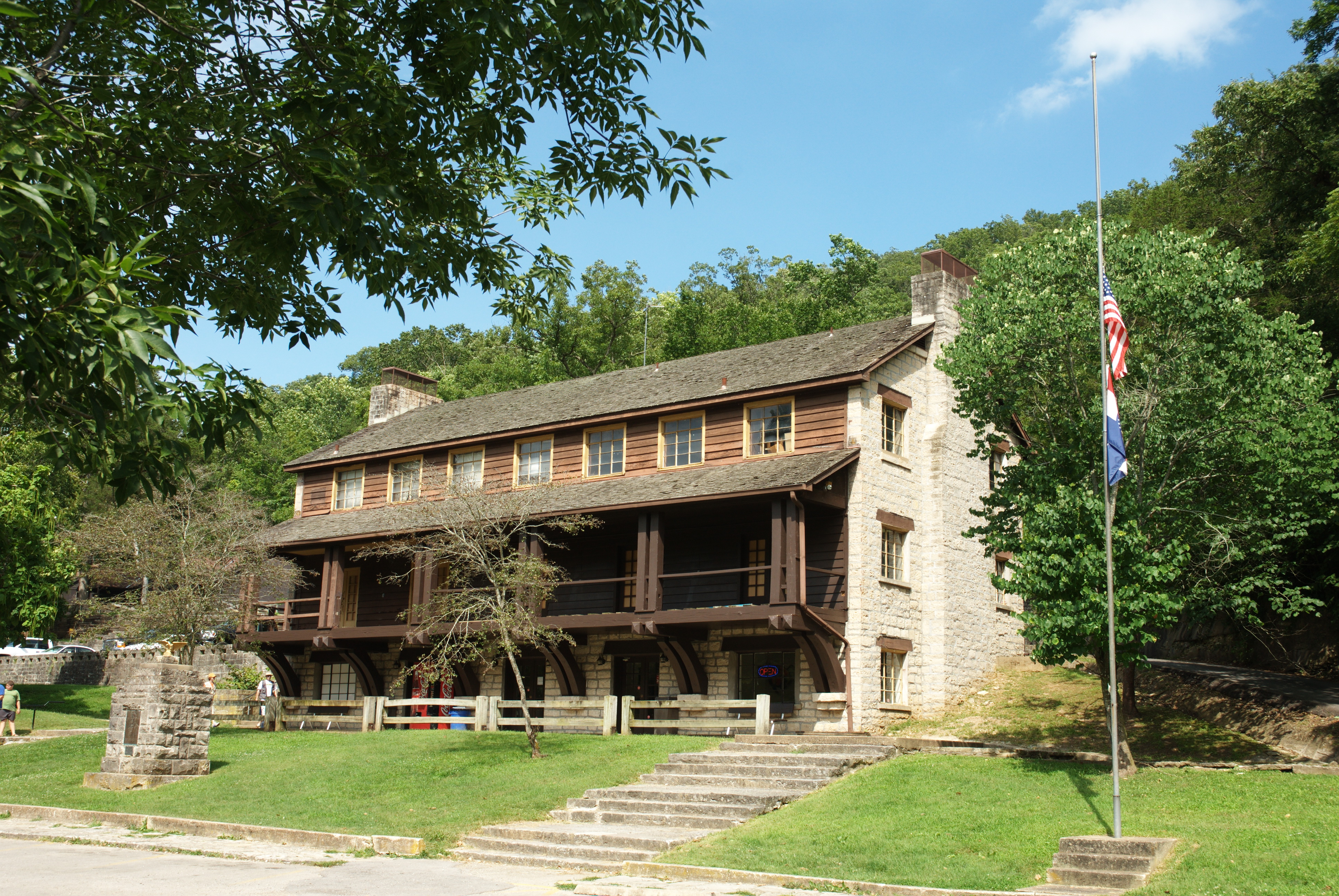 the outside of an old stone and wood 3-story building