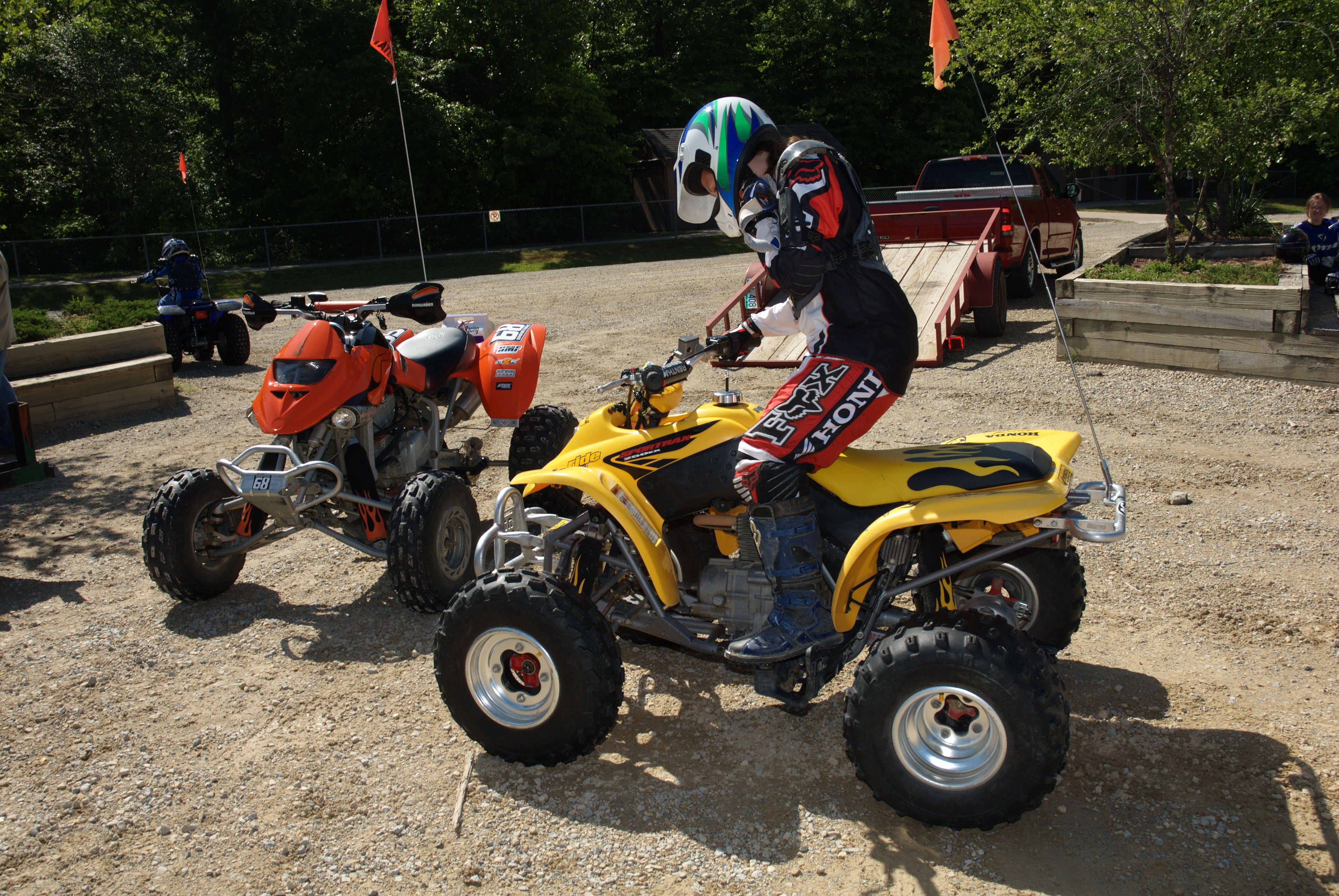 A person on a yellow four wheeler