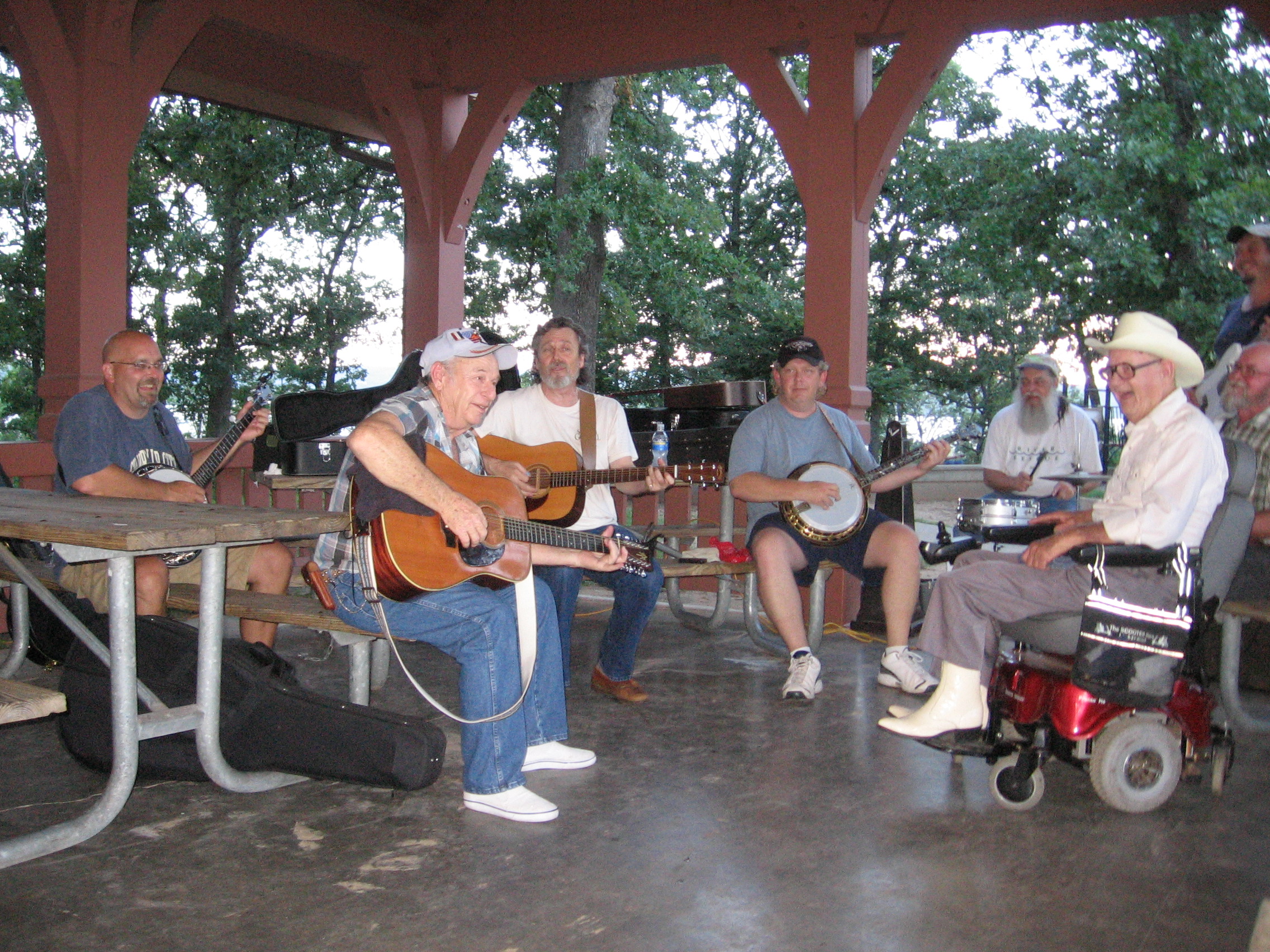 Folks playing music in a pavillion