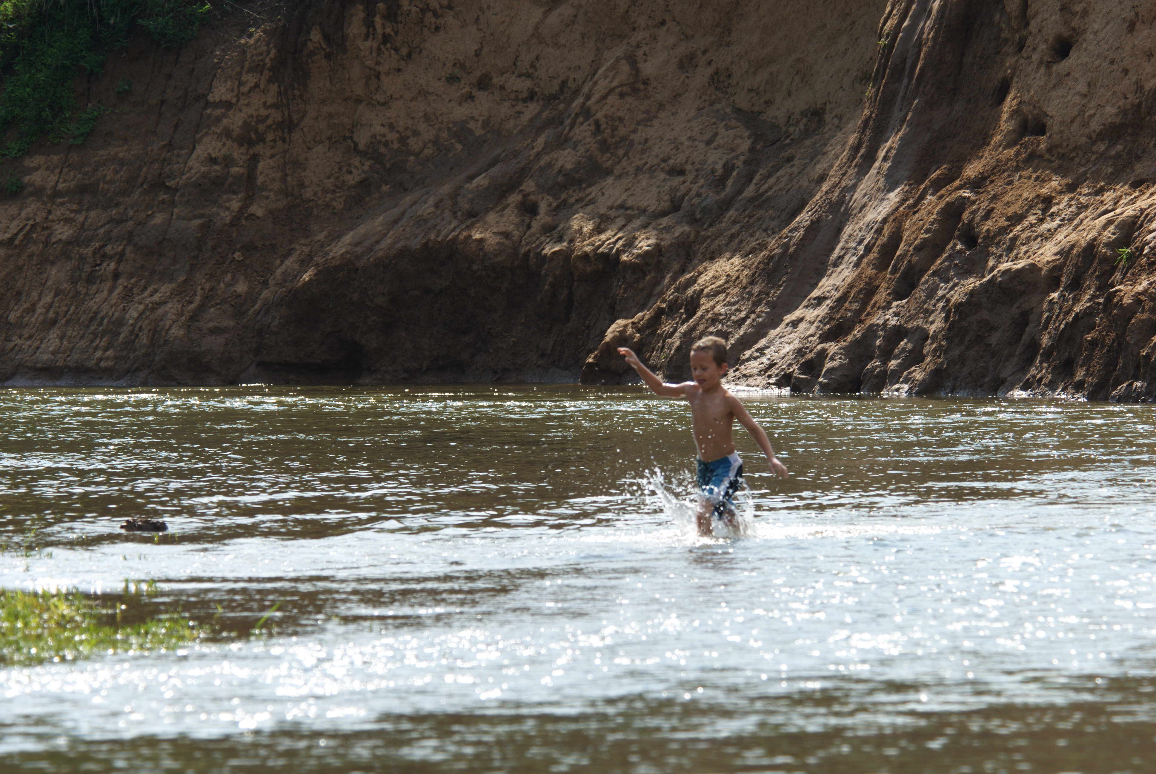 A kid splashing in the water