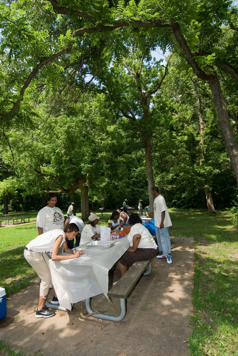 A family sitting at a picnic table