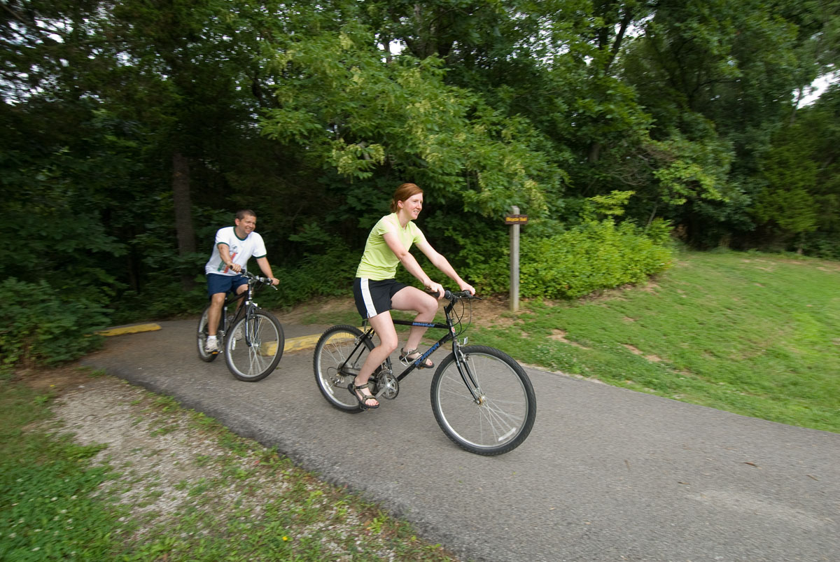 Two people biking on a trail