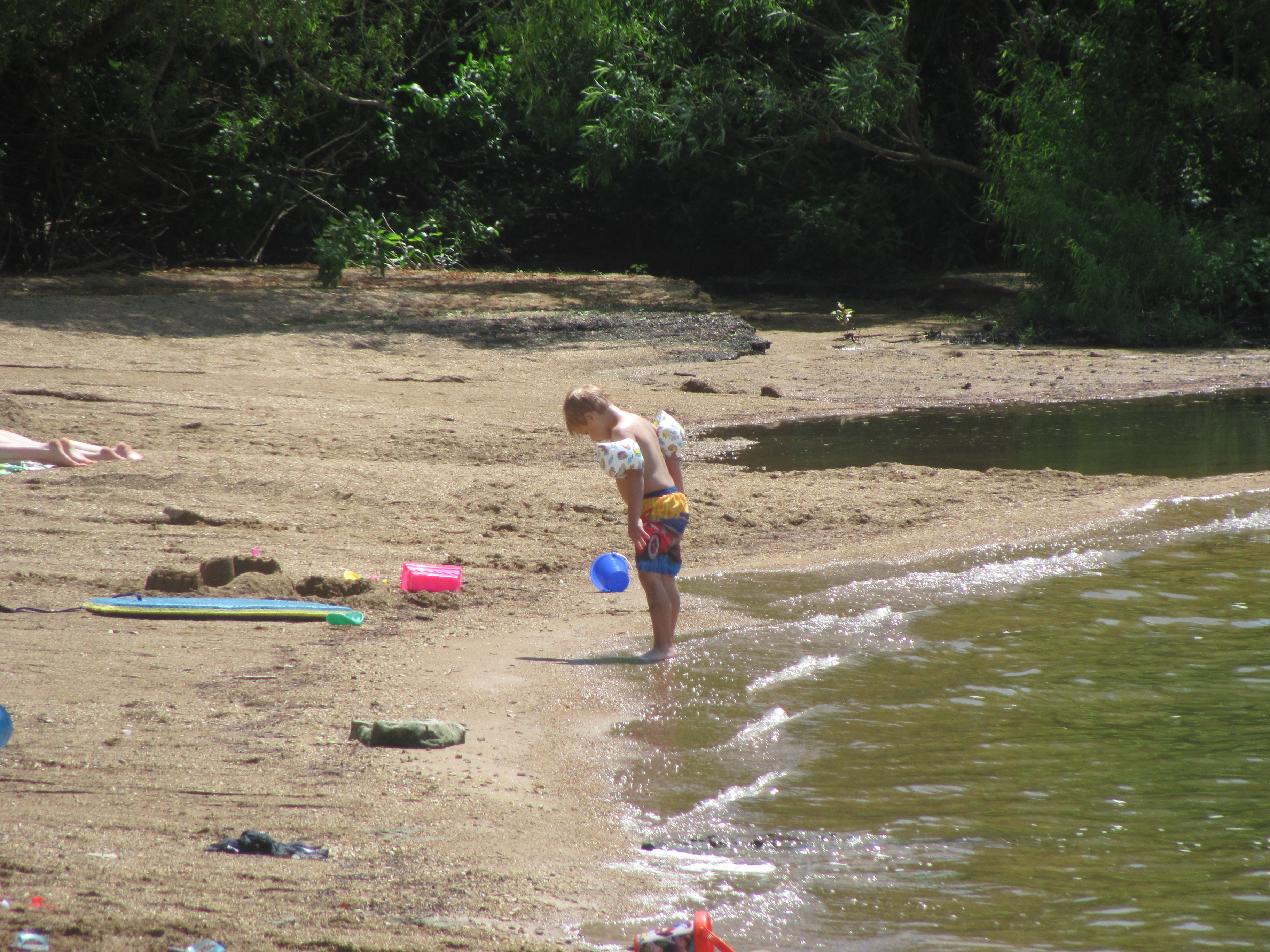 A child on the sand at a beach