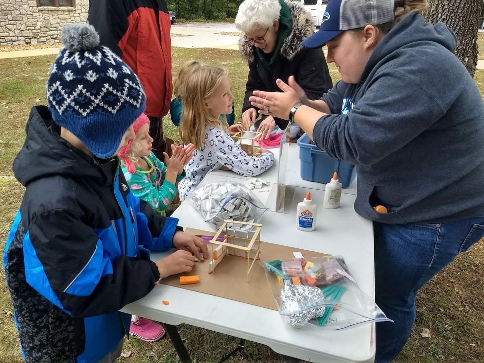 A group of kids doing a project outdoors