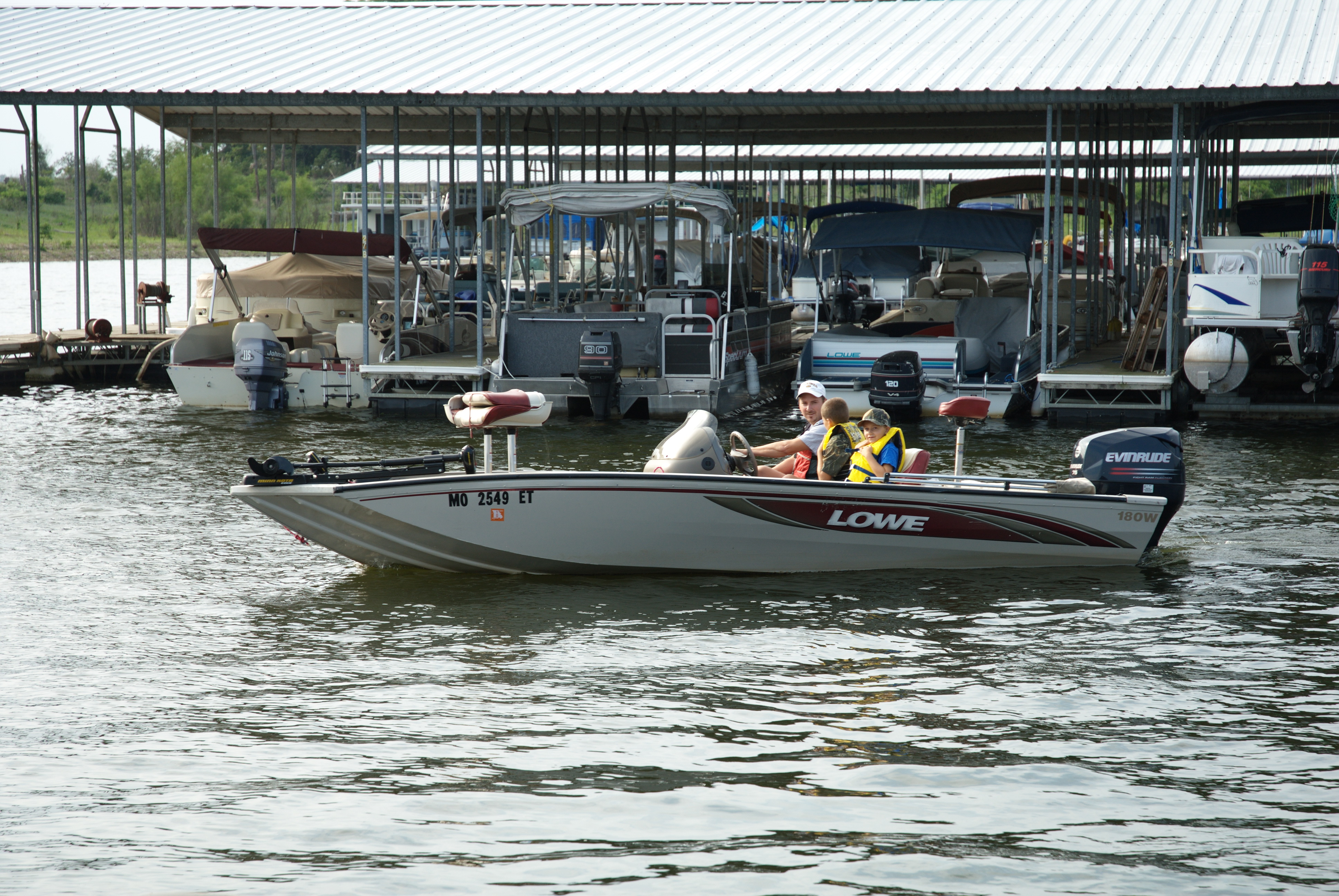 3 people on a speed boat