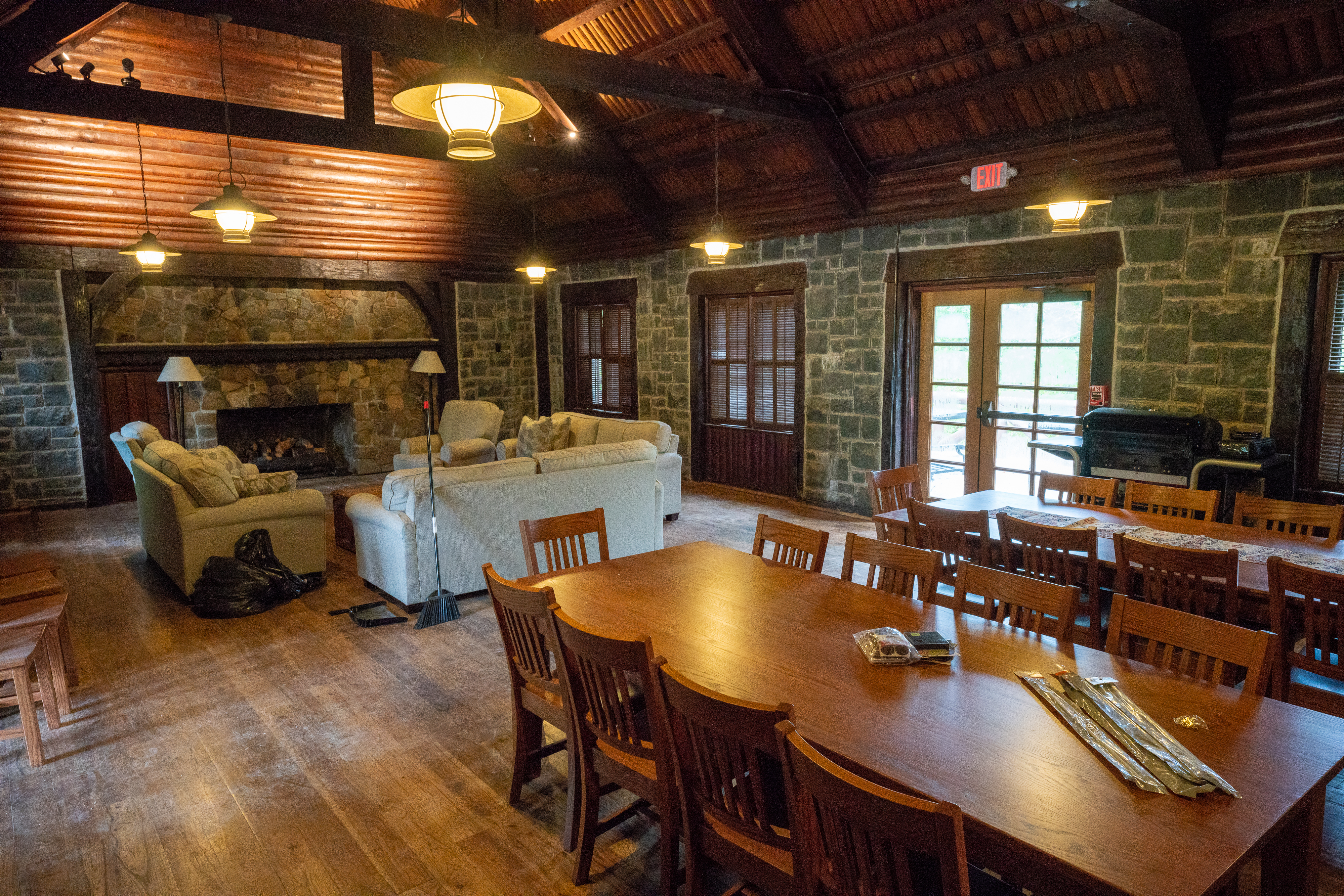 Interior view of lodge with dining tables and seating area.