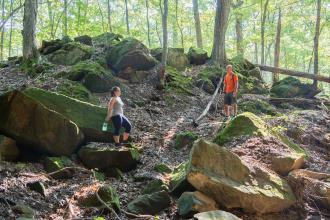 Two people climbing on rocks