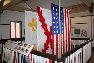 various flags hanging in the stairwell of the visitor center