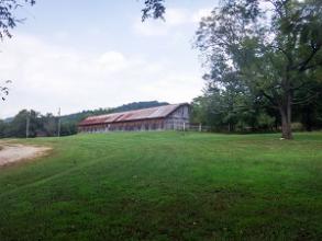 open grassy area with building in the background