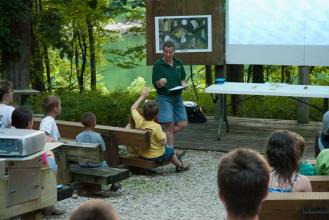 a naturalist presents a program in the amphitheater