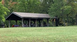 Park visitors have a picnic at the open shelter