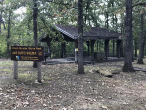 Picnic shelter with Lake Buteo Shelter sign in front