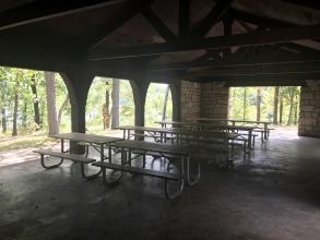 Picnic tables inside the open shelter