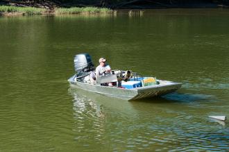 a man in a boat on the river