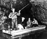 c.a. 1936 photo of people in a boat inside the cave