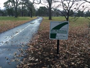 two-lane paved trail and Recreation Trails Program sign