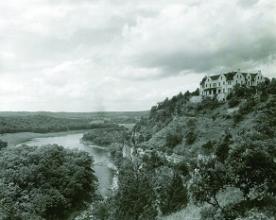 historic photo of castle on top of bluff overlooking the lake