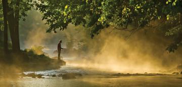 A person fishing at Roaring River