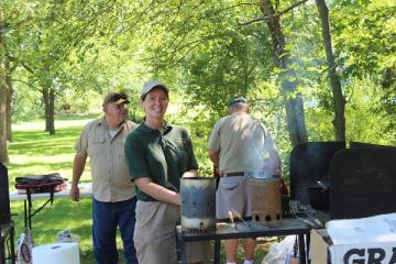 people at a Dutch oven cooking demonstration