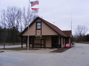 exterior of park office with American and Missouri flags in front