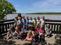 Students pose for a photo at an overlook of Mark Twain Lake