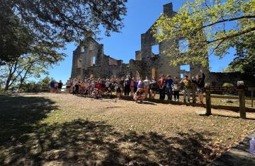 Students stand along the fence protecting the Ha Ha Tonka castle ruins