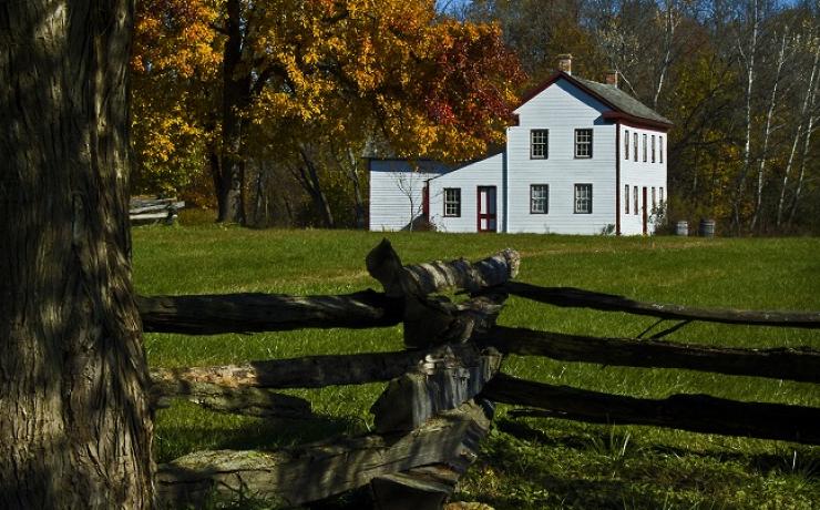 A white house and an old wooden fence