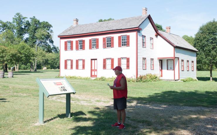 A red and white building with a sign out front