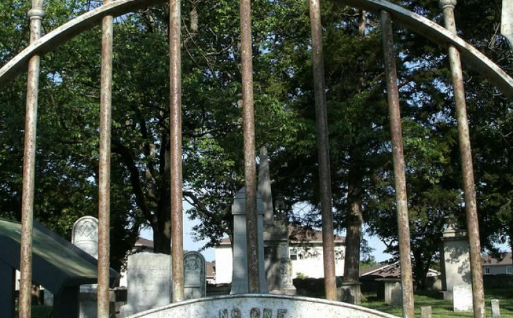 A closed gate in front of the Jewell Cemetery