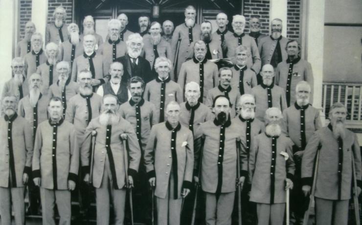 Black and white image of soldiers standing on stairs