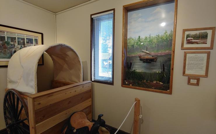 A recreation of a covered wagon on display
