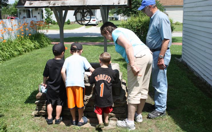 A group gathered around a well