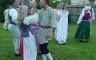 A group of historical re-enactors dancing