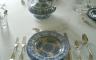 A table set with blue and white china dishes