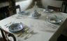 A table set with blue and white china dishes