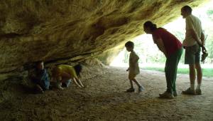 A group of people in a cave entrance