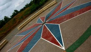 A mural of a blue and red compass rose