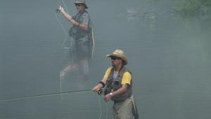people fishing in the water at Roaring River State Park