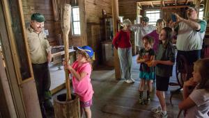 A child churning butter