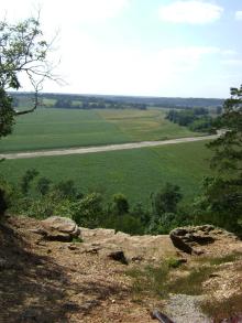 view of a road from the top of a cliff