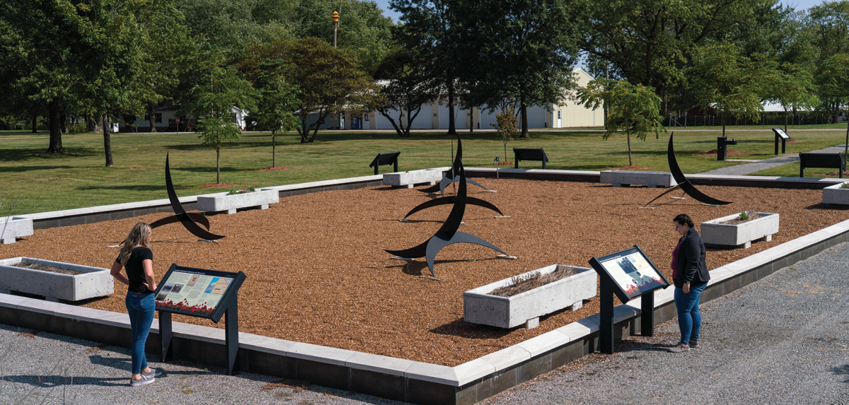 People reading information about the State Park